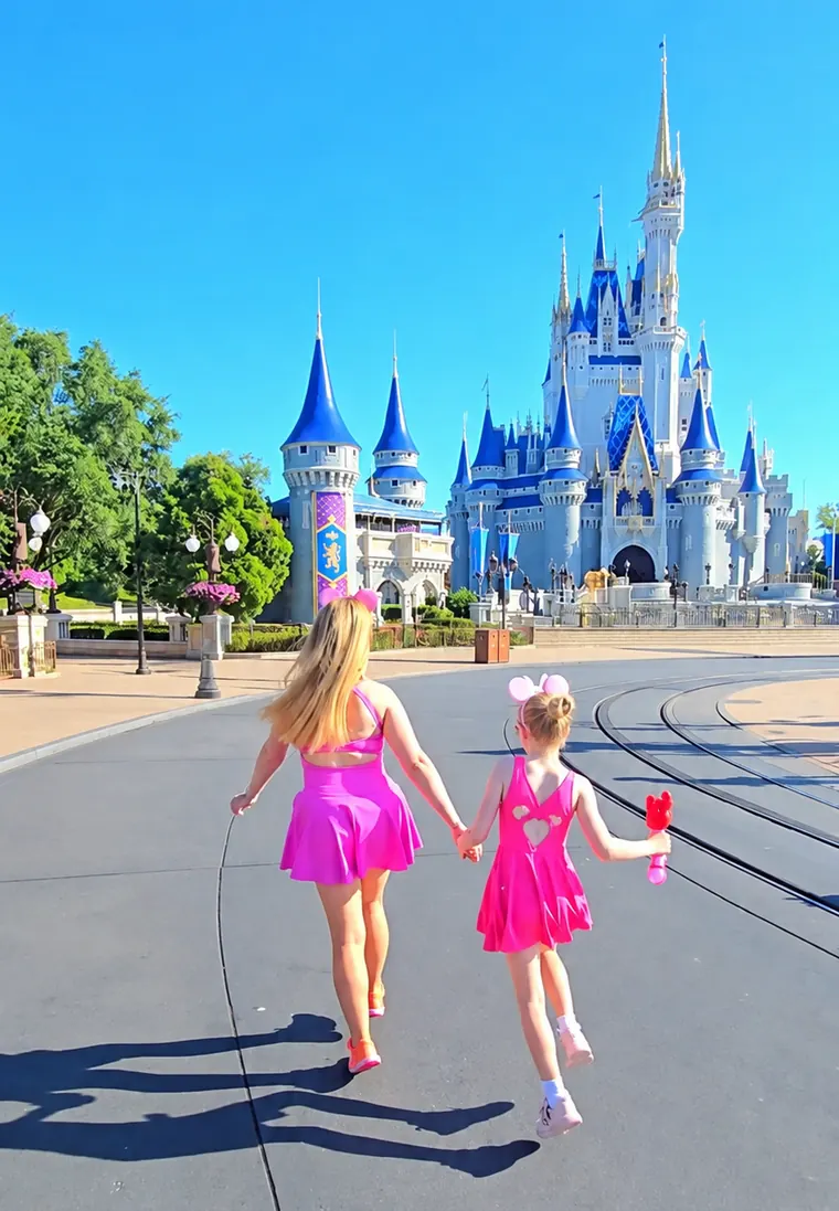 Steff walking hand in hand with her daughter towards a castle.