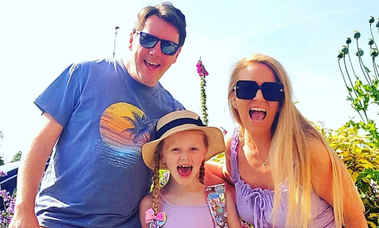 Steff with her husband and daughter on a sunny family day out.